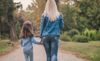 mother and daughter walking holding hands