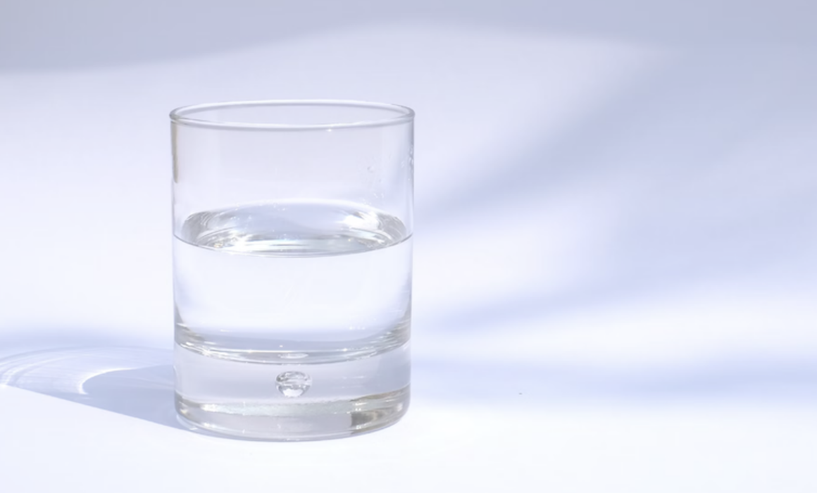 a water glass half full to represent optimism