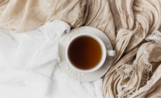 a cup of tea on a blanket