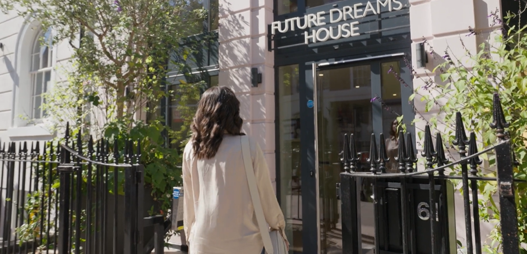Alexia walking into Future Dreams House