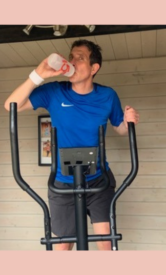 Byron training for the marathon on an exercise machine