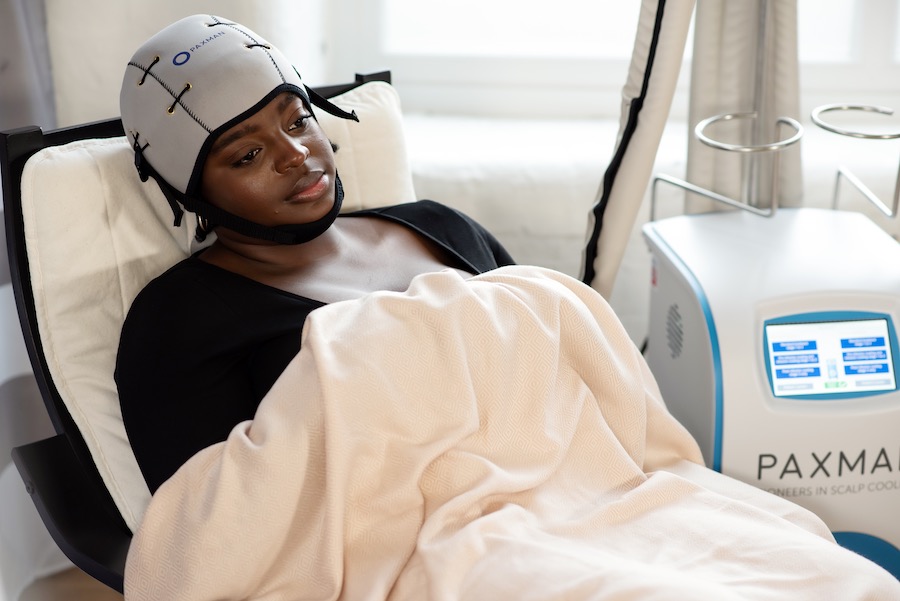 cancer patient wearing a cold cap during chemotherapy and scalp cooling
