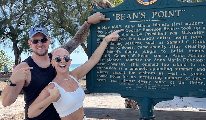 Alex and Nicky Newman at a sign reading Bean's Point