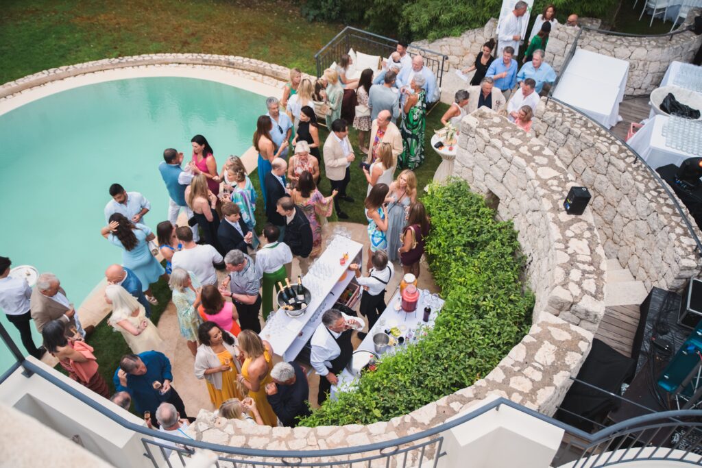 Guests in garden of villa celebrating