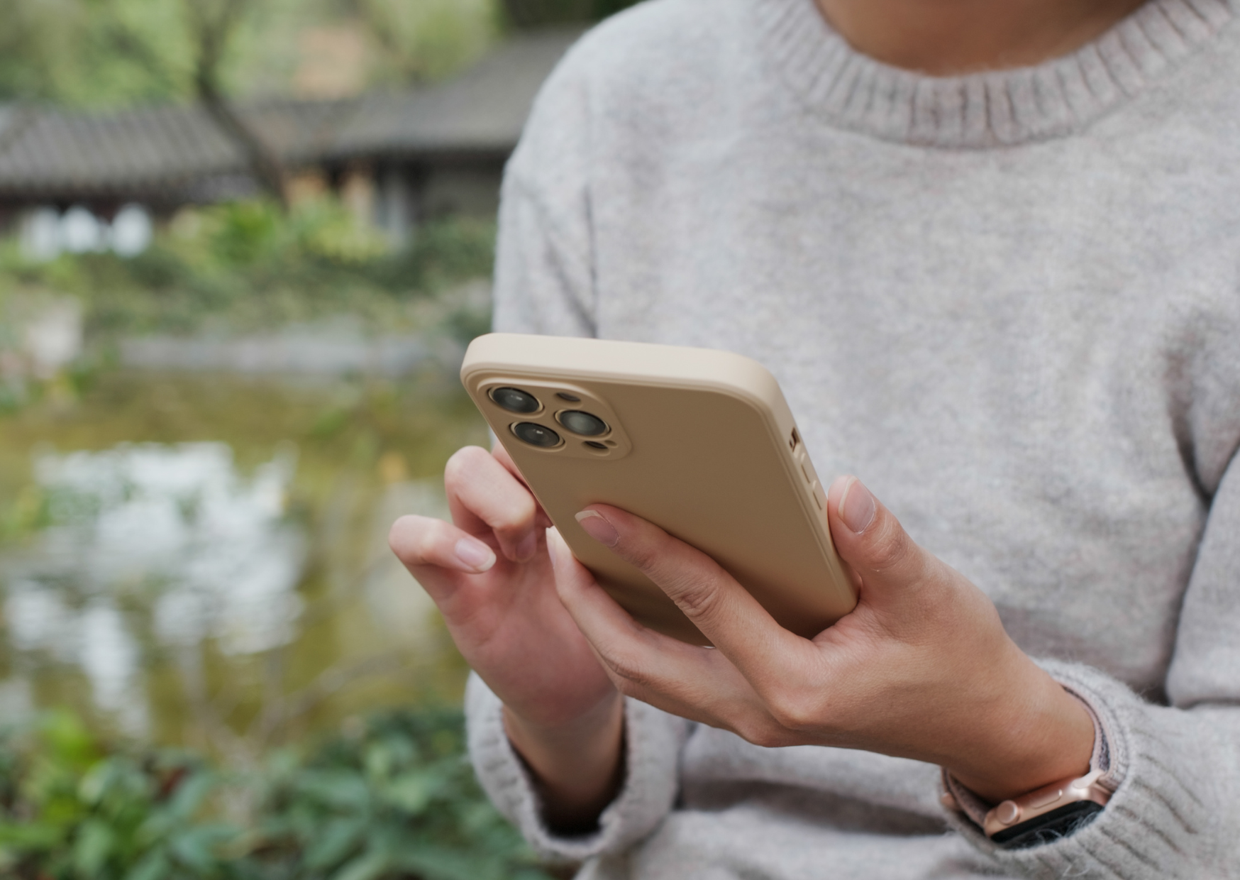 Somebody sat down looking at a mobile phone