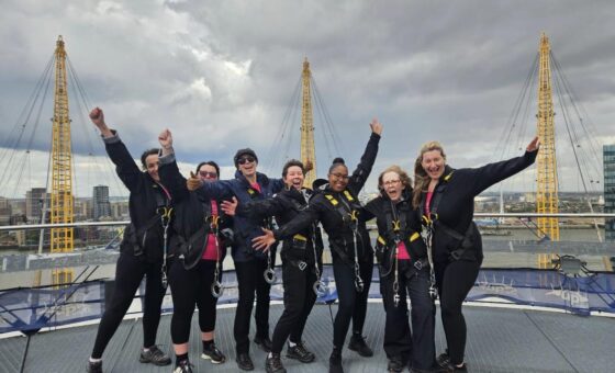 Team up on top of the O2 with hands in the air