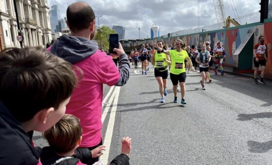 Cheer station and runners coming towards them